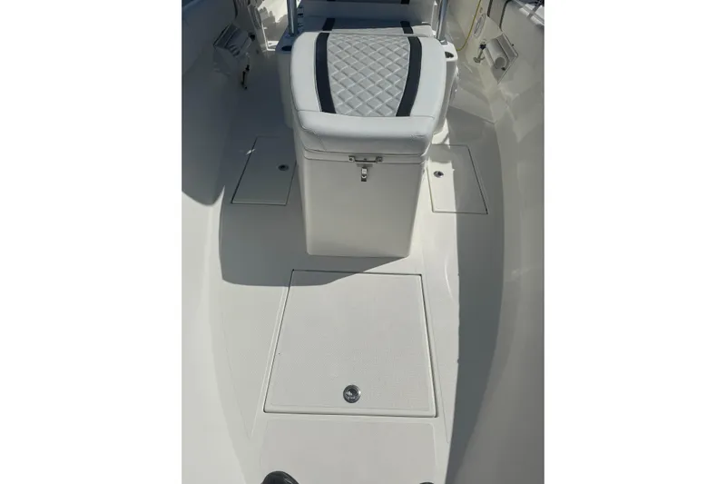  Yacht Photos Pics 2021 Sea-Lion 27 CC boat interior with cushioned seating and storage compartments.
