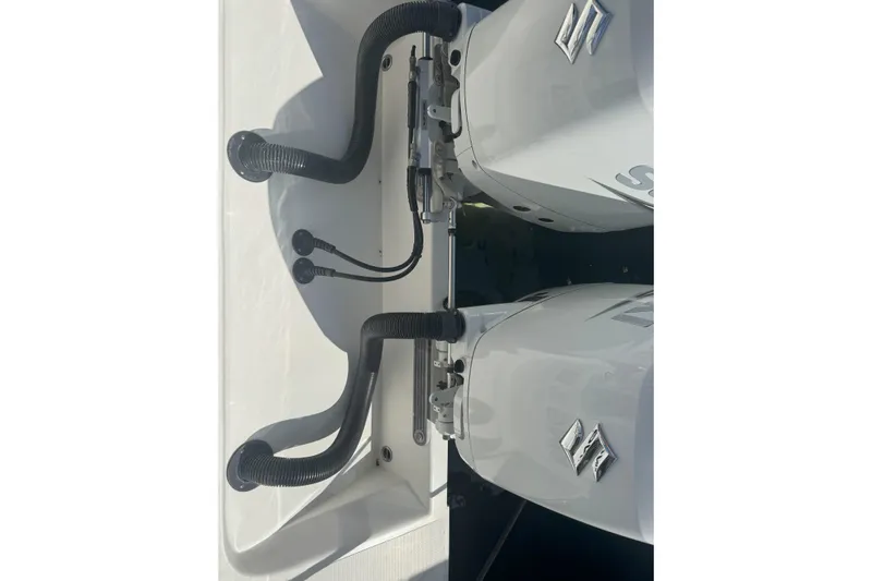  Yacht Photos Pics Twin outboard motors on a 2021 Sea-Lion 27 CC boat, featuring Suzuki engines.