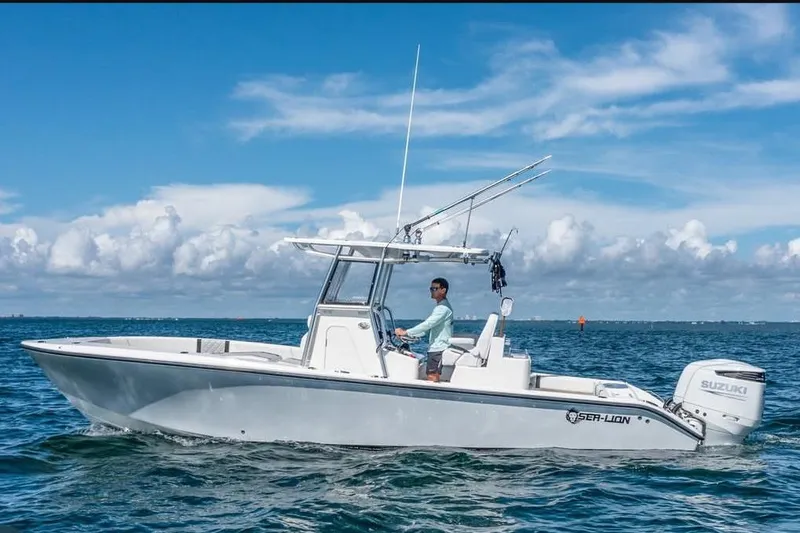  Yacht Photos Pics 2021 Sea-Lion 27 CC boat cruising on open water under clear skies.