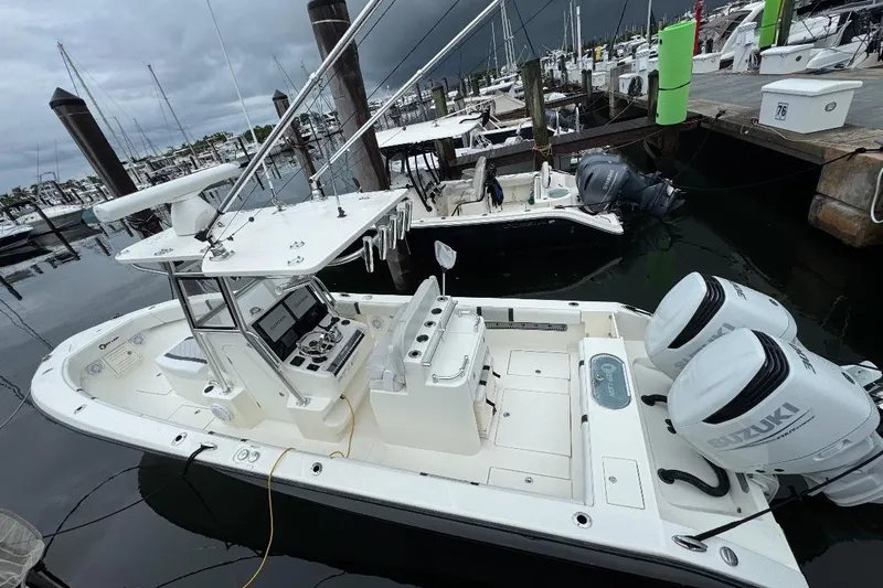  Yacht Photos Pics 2021 Sea-Lion 27 CC boat docked, featuring dual Suzuki outboard engines.