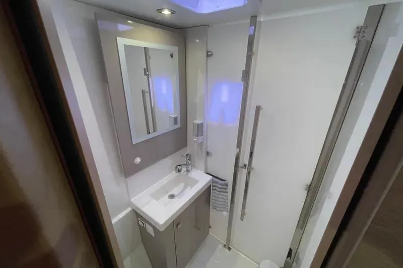 No Brainer Yacht Photos Pics Modern bathroom interior of 2022 Fountaine Pajot Astrea 42 yacht, featuring sleek design and amenities.