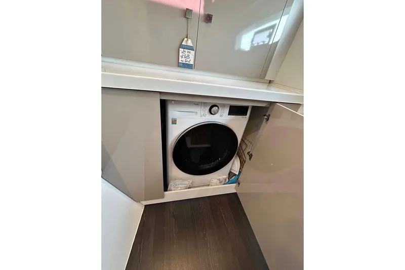 No Brainer Yacht Photos Pics Washing machine inside a cabinet on a 2022 Fountaine Pajot Astrea 42 yacht.
