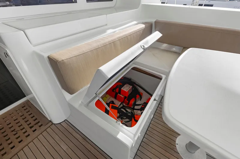 Happy Ours Yacht Photos Pics Storage compartment on 2022 Lagoon 52 F yacht with life jackets and equipment.