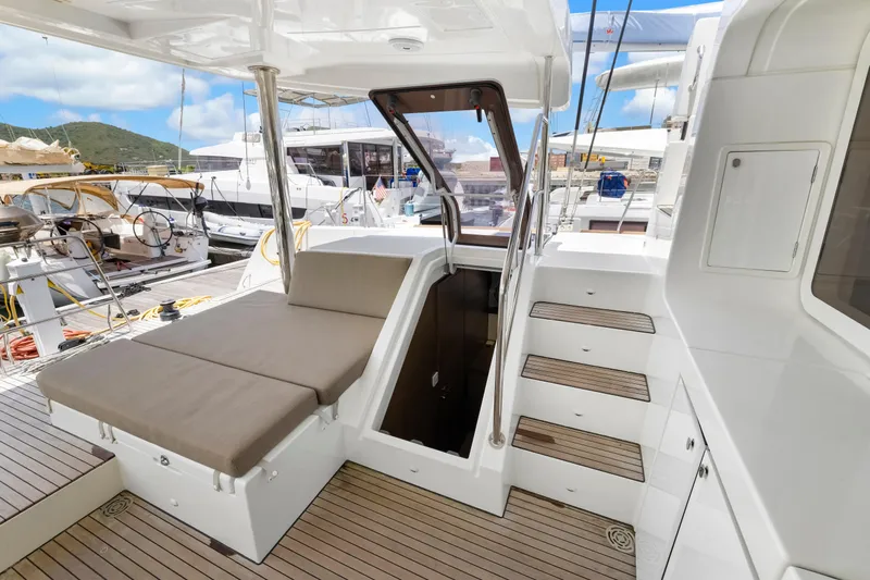 Happy Ours Yacht Photos Pics Luxurious Lagoon 52 F yacht deck with seating and stairs, 2022 model.