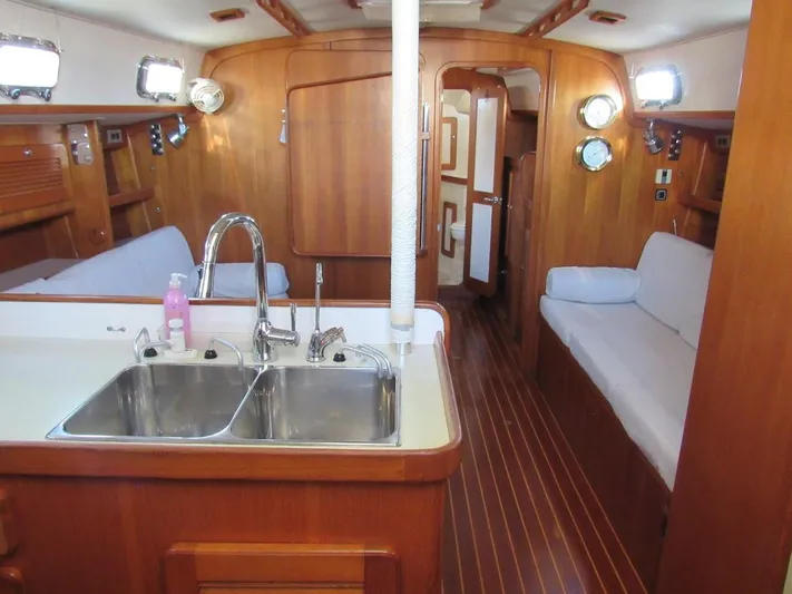 Via Yacht Photos Pics Interior of 2004 Caliber 40 LRC SE yacht with wooden finish and dual sink.