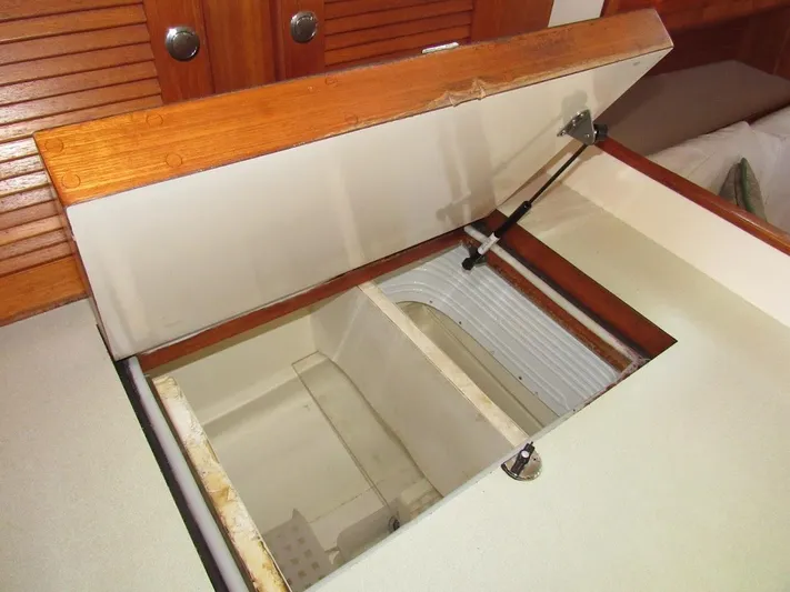 Via Yacht Photos Pics Open storage compartment on 2004 Caliber 40 LRC SE boat with wooden finish.