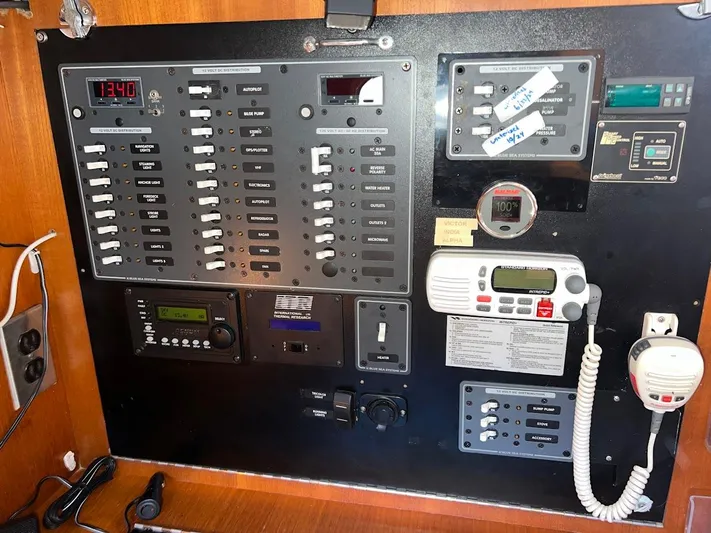 Via Yacht Photos Pics Electrical control panel on a 2004 Caliber 40 LRC SE yacht, featuring various switches and gauges.