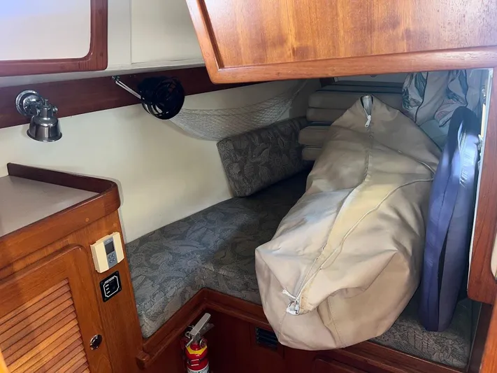 Via Yacht Photos Pics Cozy cabin interior of 2004 Caliber 40 LRC SE sailboat with storage and seating.