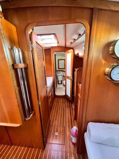 Via Yacht Photos Pics Interior of 2004 Caliber 40 LRC SE yacht with wooden finish and cozy cabin layout.