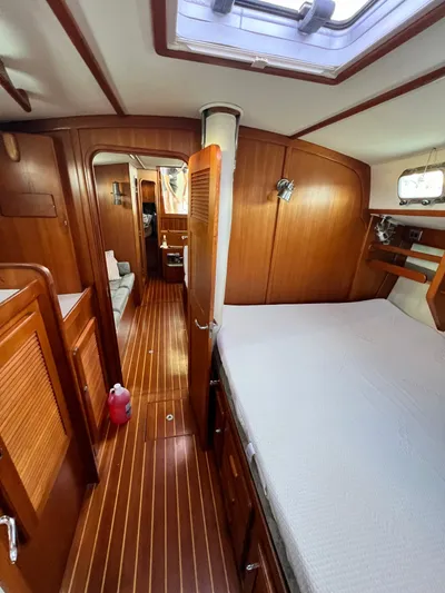 Via Yacht Photos Pics Interior of 2004 Caliber 40 LRC SE sailboat with wooden finish and cozy cabin.