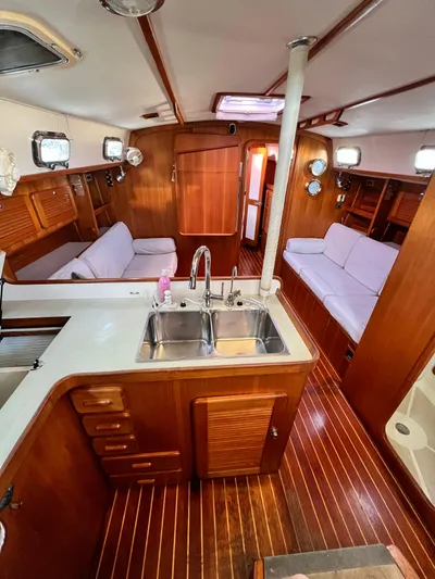 Via Yacht Photos Pics Interior of 2004 Caliber 40 LRC SE yacht with wood finish and dual sink kitchen.