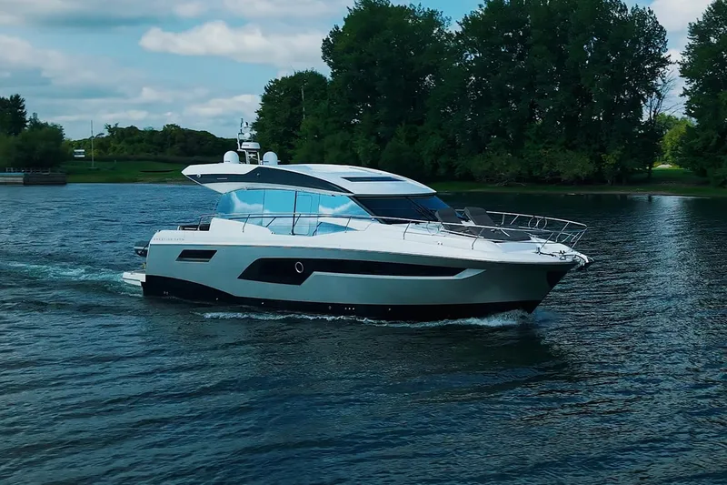 Prestige 520s Yacht Photos Pics Luxury 2018 Prestige 520S yacht cruising on a serene lake.