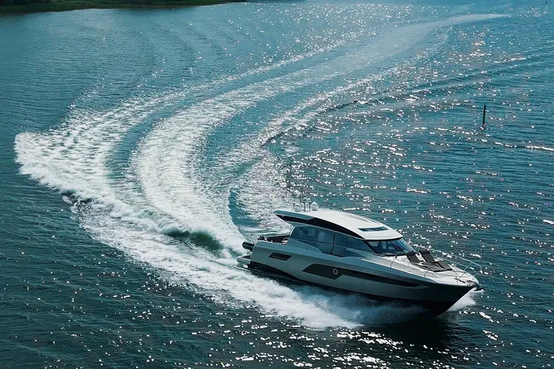 Prestige 520s Yacht Photos Pics 2018 Prestige 520S yacht cruising on sparkling blue water, leaving a dynamic wake.