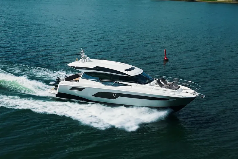 Prestige 520s Yacht Photos Pics Luxurious 2018 Prestige 520S yacht cruising on open water, showcasing sleek design and elegance.