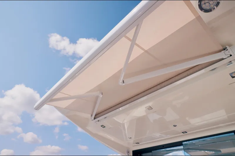 Prestige 520s Yacht Photos Pics Awning on 2018 Prestige 520S yacht under a clear blue sky.
