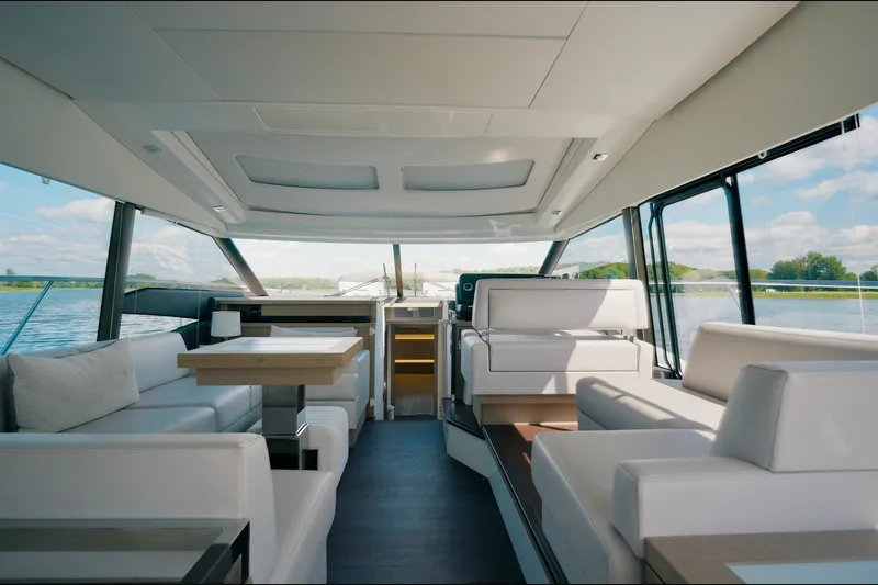 Prestige 520s Yacht Photos Pics Luxurious interior of a 2018 Prestige 520S yacht with elegant seating and scenic water views.