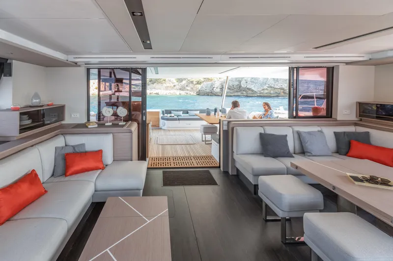 Samana 59 In St.thomas. Ex-factory Nov 2025 Yacht Photos Pics Luxurious interior of 2024 Fountaine Pajot Samana 59 yacht with modern seating and ocean view.
