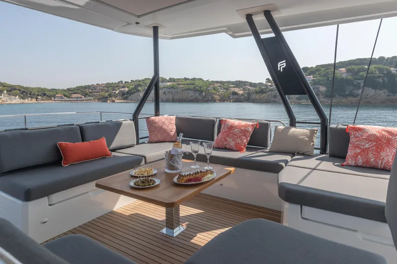 Samana 59 In St.thomas. Ex-factory Nov 2025 Yacht Photos Pics 2024 Fountaine Pajot Samana 59 yacht with luxurious outdoor seating and scenic ocean view.