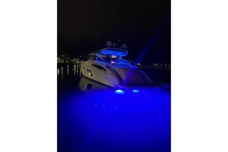  Yacht Photos Pics 2015 Princess V62-S yacht illuminated with blue lights at night.