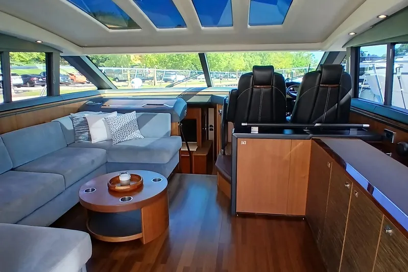  Yacht Photos Pics Luxurious interior of 2015 Princess V62-S yacht with modern seating and panoramic windows.
