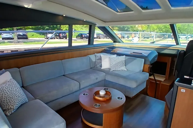  Yacht Photos Pics Luxurious interior of 2015 Princess V62-S yacht with plush seating and modern design.