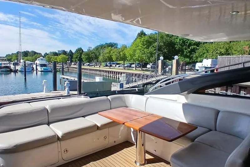  Yacht Photos Pics Luxurious 2015 Princess V62-S yacht interior with marina view and comfortable seating.