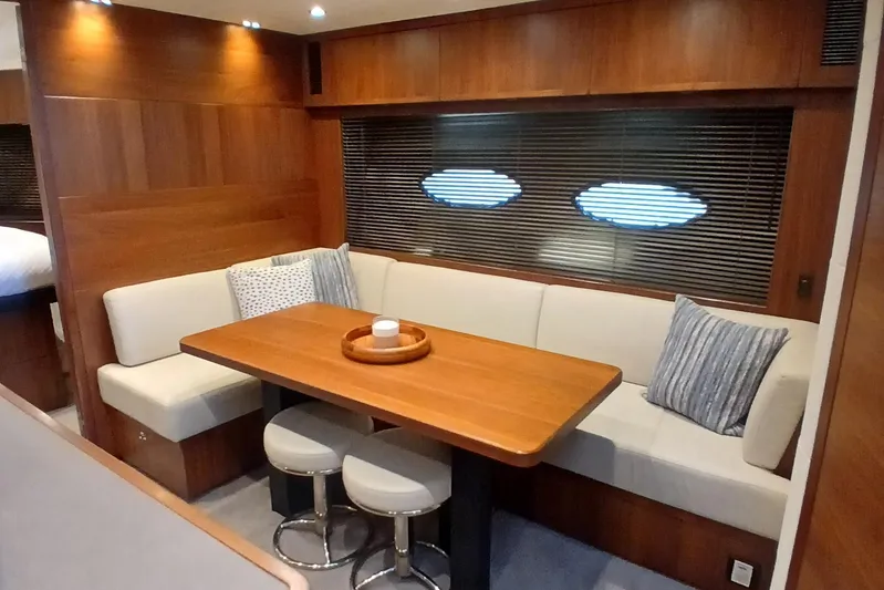  Yacht Photos Pics Luxurious 2015 Princess V62-S yacht interior with elegant dining area and plush seating.