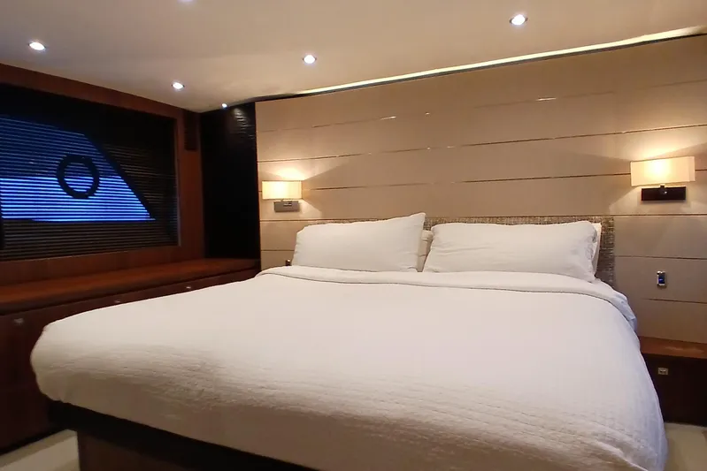  Yacht Photos Pics Luxurious bedroom interior on 2015 Princess V62-S yacht with modern lighting and cozy bedding.