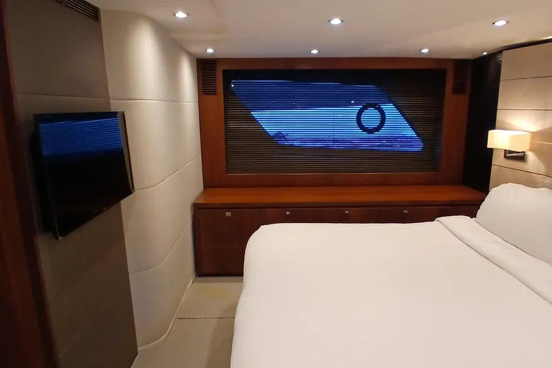  Yacht Photos Pics Luxurious bedroom interior of 2015 Princess V62-S yacht with modern design elements.
