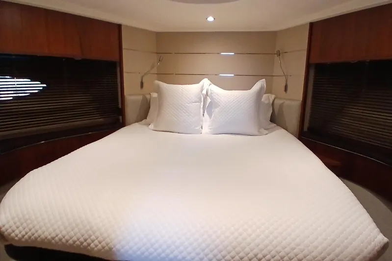  Yacht Photos Pics Luxurious bedroom interior of 2015 Princess V62-S yacht with elegant bedding.