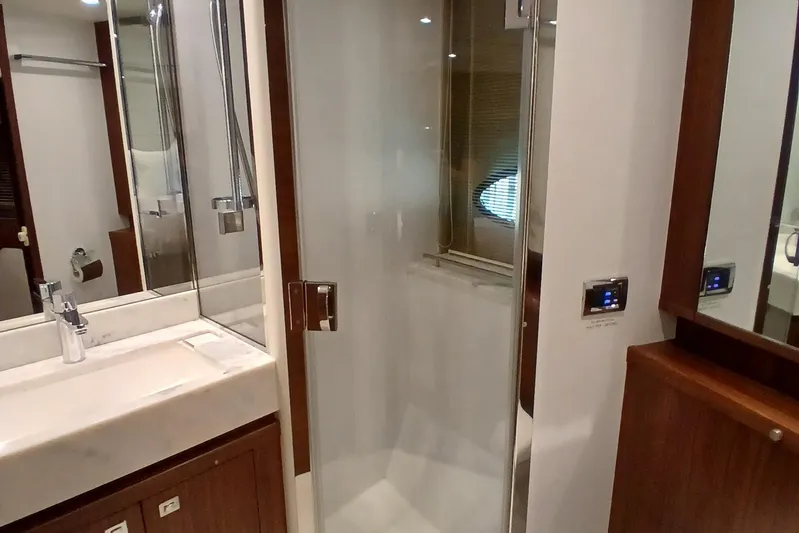  Yacht Photos Pics Luxurious bathroom in 2015 Princess V62-S yacht with modern shower and sink.