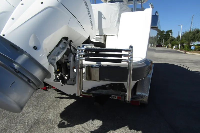  Yacht Photos Pics 2025 Nimbus Tender 9 boat with Mercury engine on a trailer, rear view.