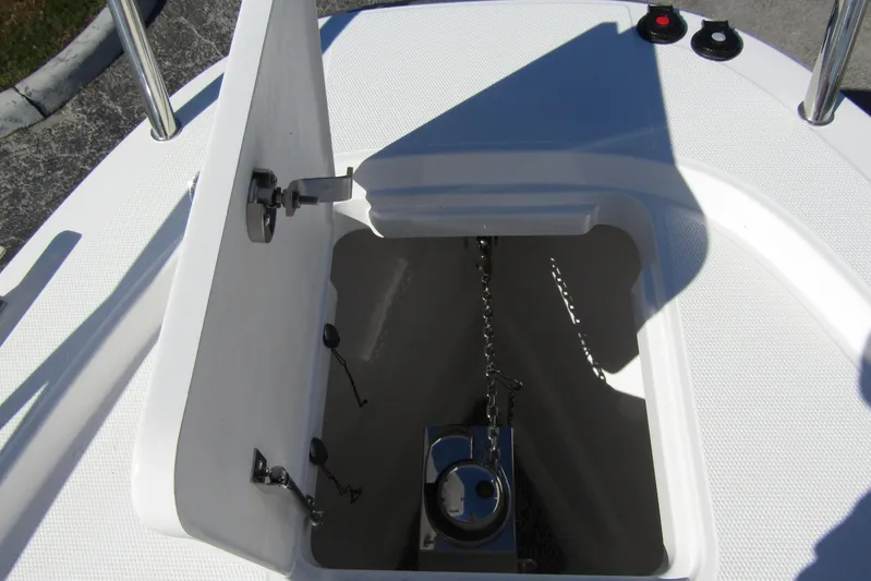  Yacht Photos Pics Open anchor compartment on 2025 Nimbus Tender 9 boat, showing chain and mechanism.