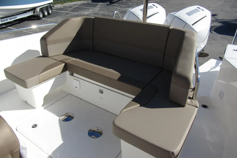  Yacht Photos Pics Luxurious seating on 2025 Nimbus Tender 9 boat, featuring comfortable brown cushions.