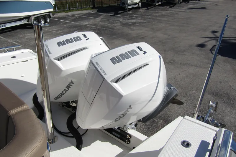  Yacht Photos Pics Twin Mercury outboard engines on a 2025 Nimbus Tender 9 boat, parked on a lot.