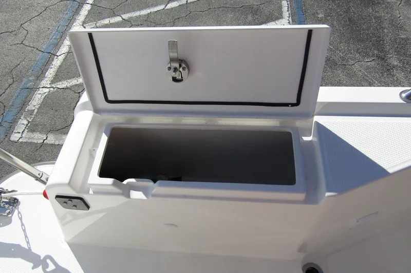  Yacht Photos Pics Open storage compartment on 2025 Nimbus Tender 9 boat, showcasing interior space.