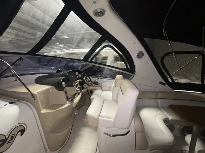  Yacht Photos Pics Interior of 2008 Four Winns V358 yacht with modern helm and seating area.