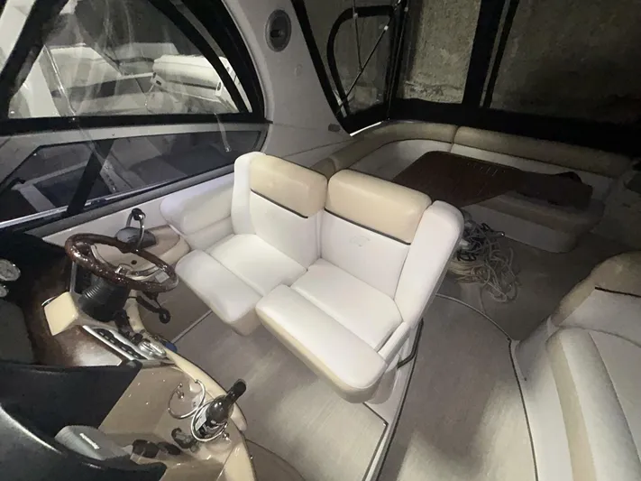  Yacht Photos Pics Interior of 2008 Four Winns V358 boat with white seating and steering wheel.