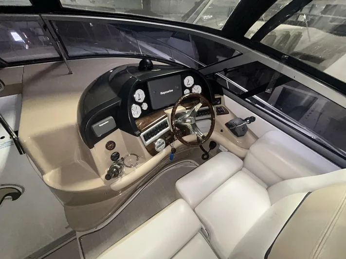  Yacht Photos Pics 2008 Four Winns V358 boat cockpit with steering wheel and control panel.