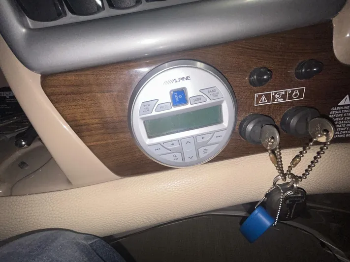  Yacht Photos Pics Control panel of a 2008 Four Winns V358 boat with Alpine system and keychain.