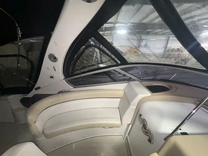  Yacht Photos Pics Interior view of 2008 Four Winns V358 boat with curved seating and modern design.