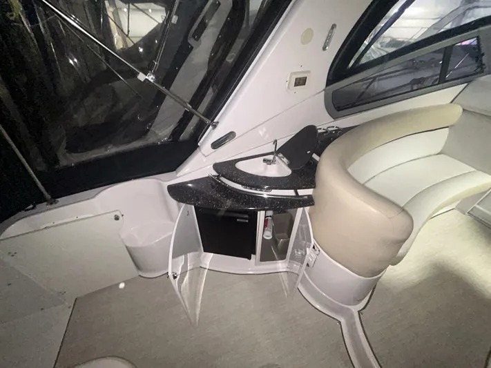  Yacht Photos Pics 2008 Four Winns V358 yacht interior with seating and kitchenette area.