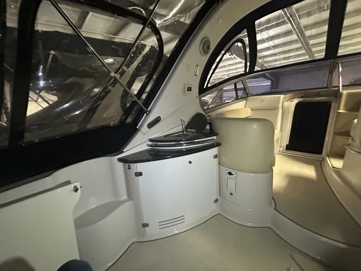  Yacht Photos Pics 2008 Four Winns V358 yacht interior with seating and kitchenette area.