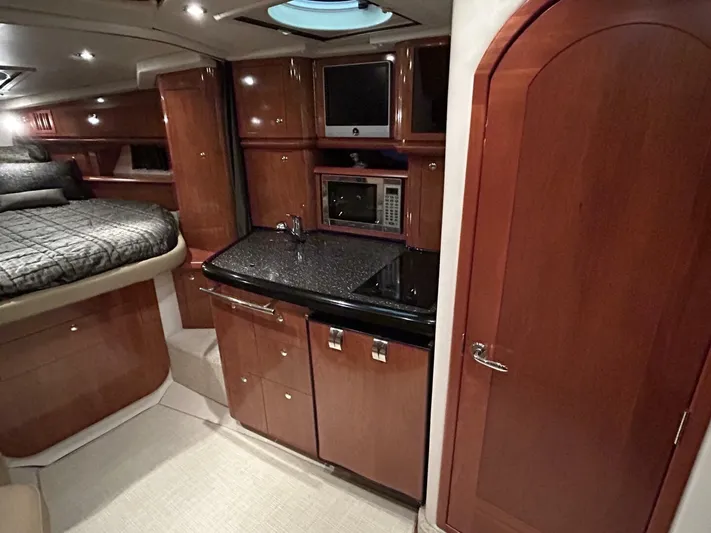  Yacht Photos Pics Luxurious 2008 Four Winns V358 yacht interior with wood cabinetry and modern amenities.
