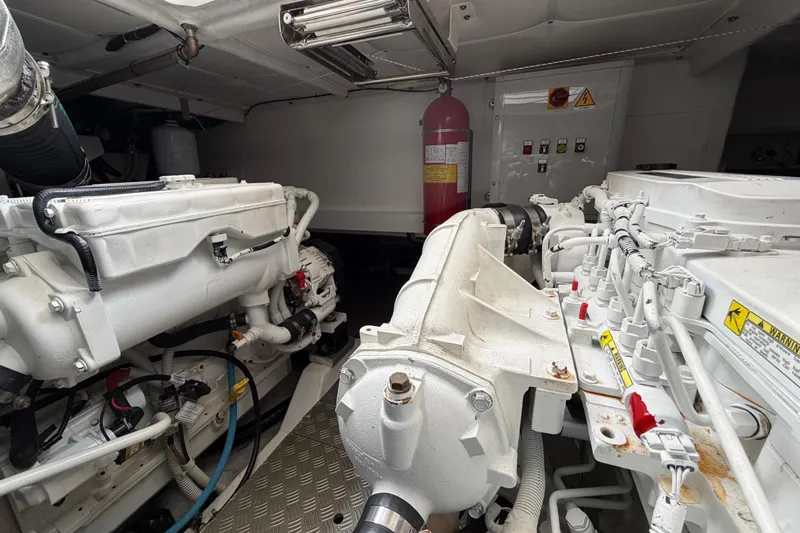  Yacht Photos Pics Engine room of 2023 Ferretti Yachts 500, featuring dual engines and safety equipment.