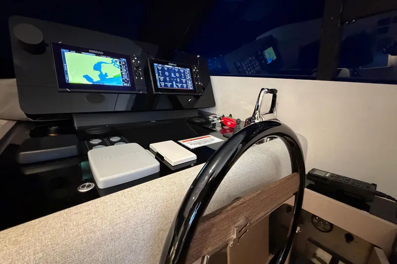  Yacht Photos Pics 2023 Ferretti Yachts 500 helm with navigation screens and steering wheel.