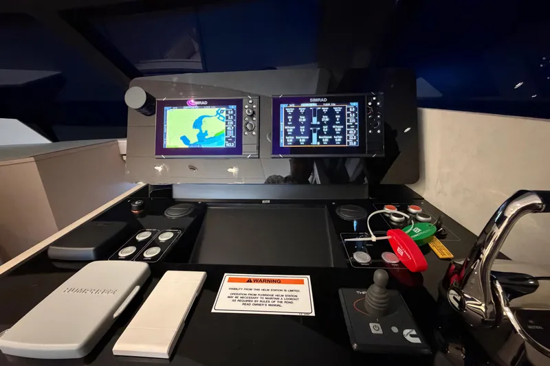  Yacht Photos Pics Control panel of 2023 Ferretti Yachts 500 with navigation screens and controls.