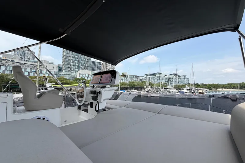  Yacht Photos Pics 2023 Ferretti Yachts 500 interior with marina view, featuring modern helm and seating.