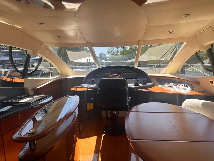  Yacht Photos Pics Luxurious interior of a 2007 Azimut 55E yacht with modern helm and seating.