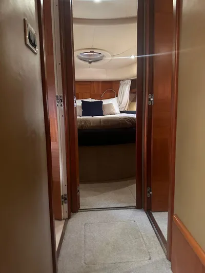 Yacht Photos Pics Interior view of 2007 Azimut 55E yacht cabin with bed and wooden finishes.